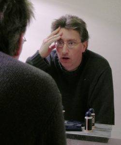 Man looking into the mirror at himself