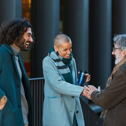 Catholic Professional business people talking and meeting on the street.